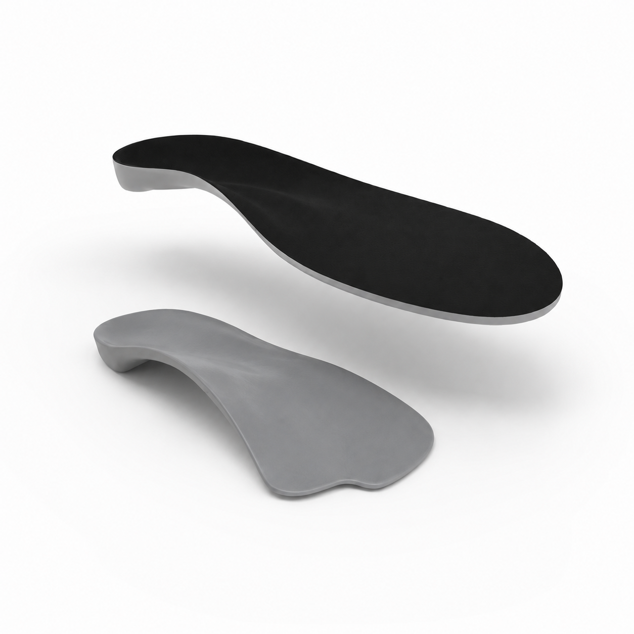 Black and gray shoe insoles on a white background