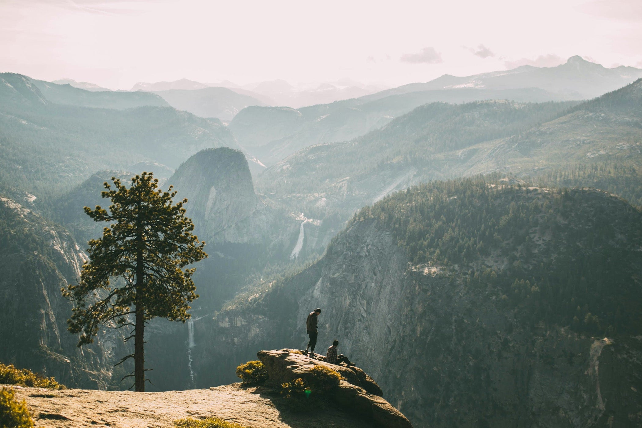 People at the  top of a mountain
