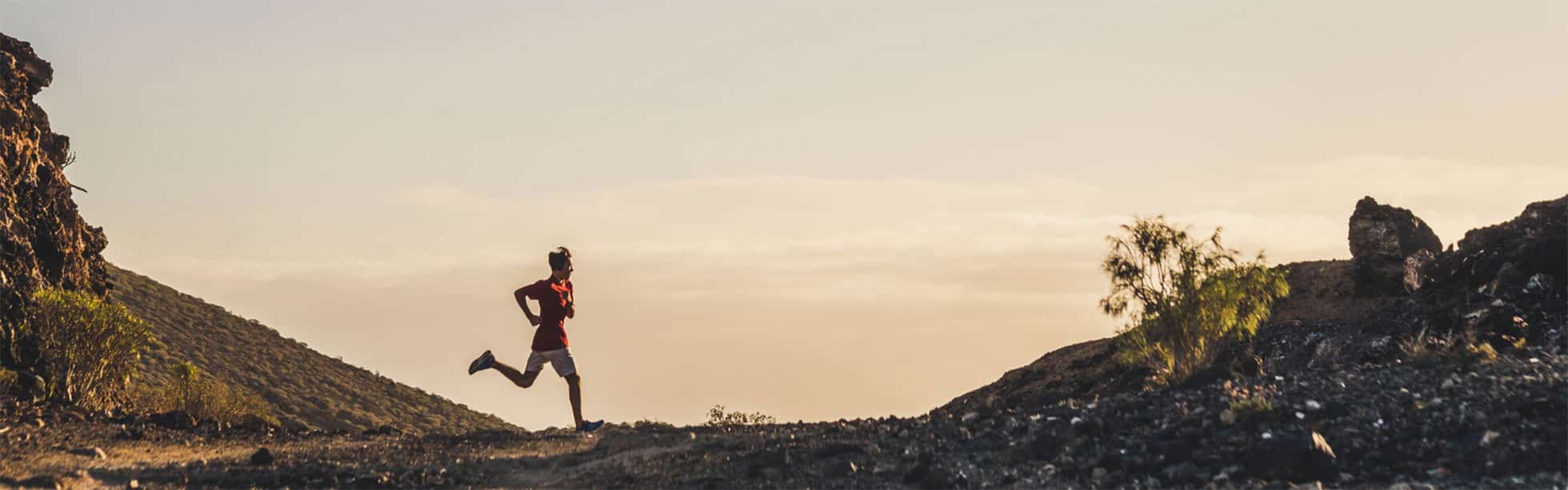 Runner in arid landscape