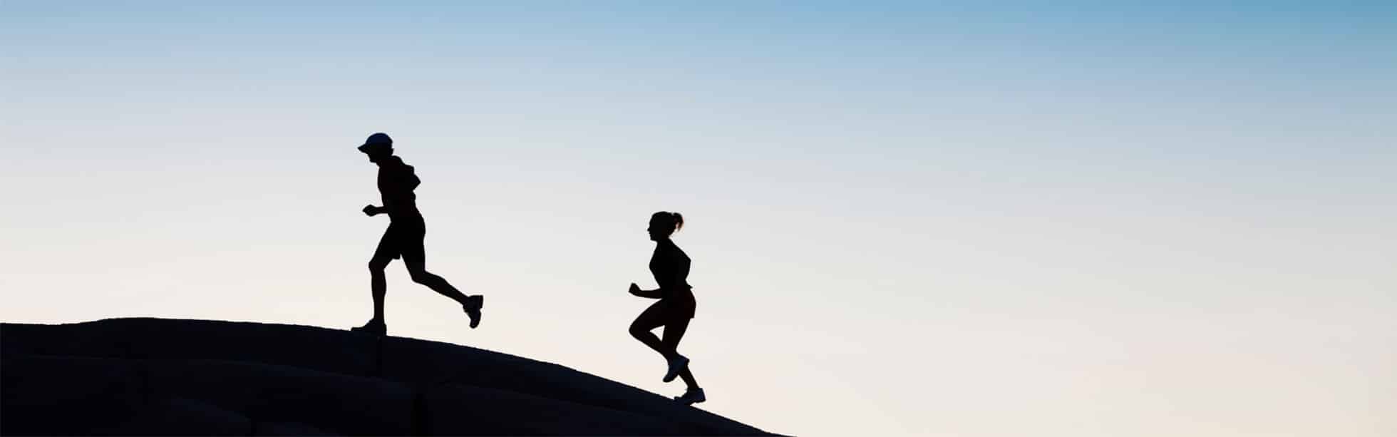 Runners at sunset