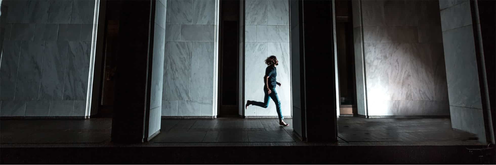 Man running through hallway