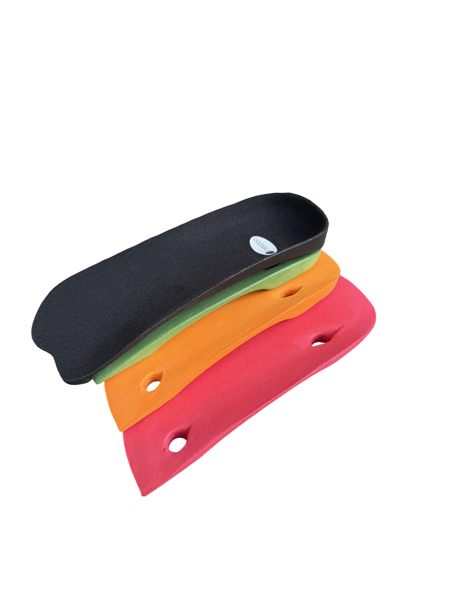 Interpod modular orthotics shown in different colors on a plain white background: one black piece at the top and three coloured pieces below in green, orange, and red