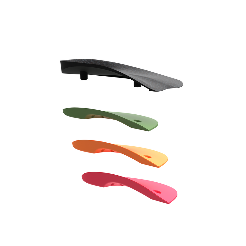Interpod modular orthotics shown in different colors on a plain white background: one black piece at the top and three colored pieces below in green, orange, and red